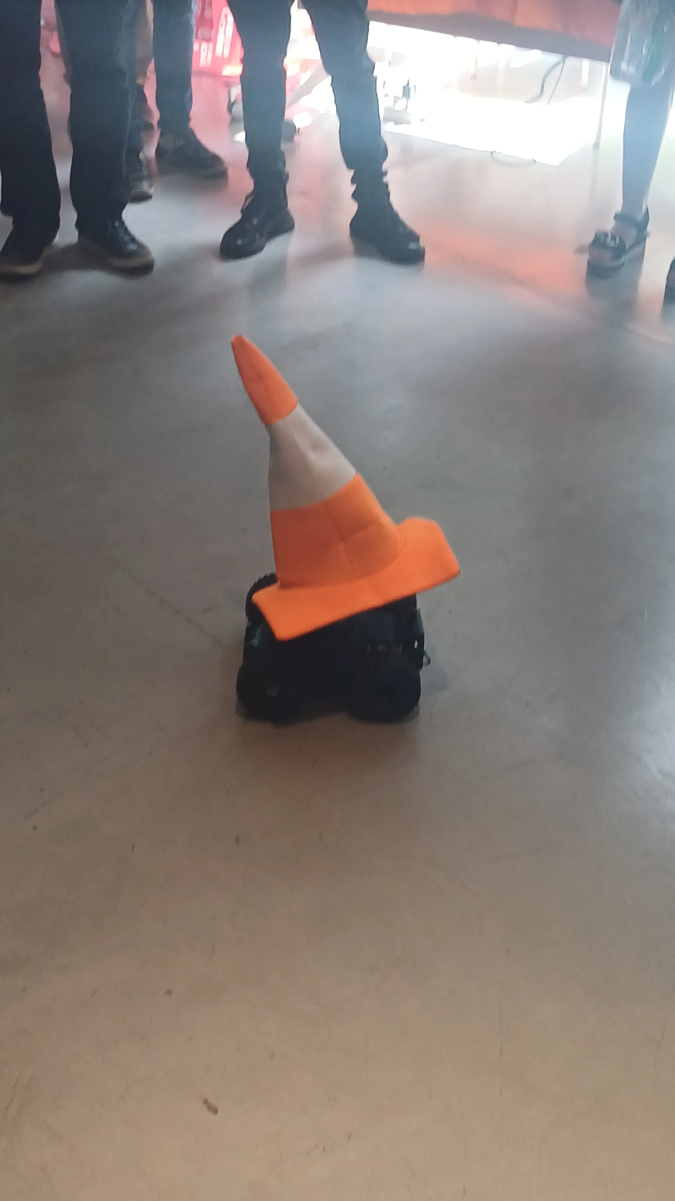 A remote-controlled robot with the VLC cone hat on top